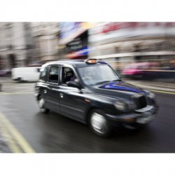Photographic Print of London Cab Travelling Through Traffic